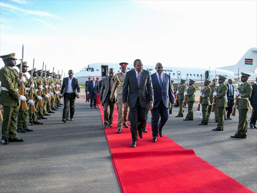 President Uhuru Kenyatta on arrival at Entebbe International Airport, Uganda, on Saturday, November 19. /PSCU