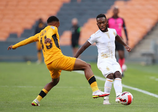 Tshidiso Monamodi of Royal AM is challenged by Njabulo Blom of Kaizer Chiefs in the DStv Premiership match at FNB Stadium on September 18 2021.