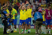 Neymar of Brazil applauds fans with teammates following the World Cup last-16 win against South Korea at Stadium 974 in Doha, Qatar on December 5 2022.