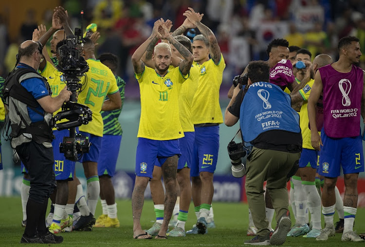 Neymar of Brazil applauds fans with teammates following the World Cup last-16 win against South Korea at Stadium 974 in Doha, Qatar on December 5 2022.