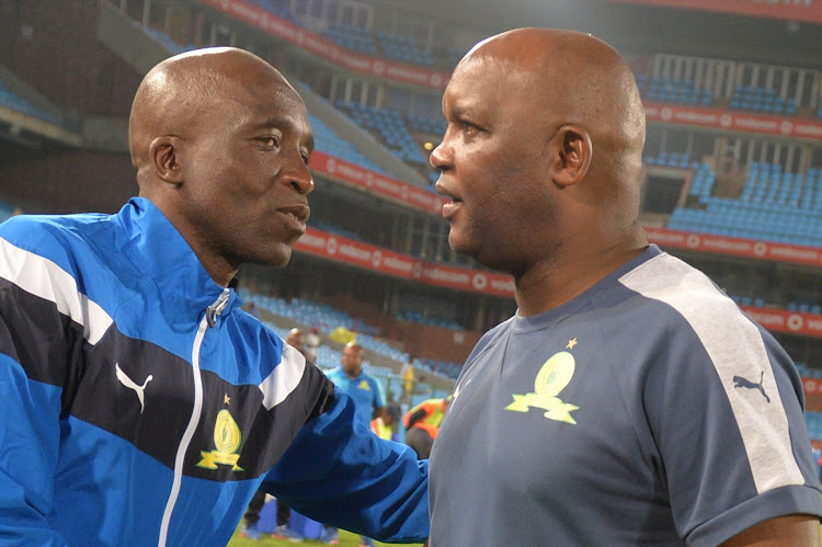 Mamelodi Sundowns' Multichoice Diski Challenge head coach David Notoane (L) congratulates the first team boss Pitso Mosimane (R) after an Absa Premiershi match at Loftus.