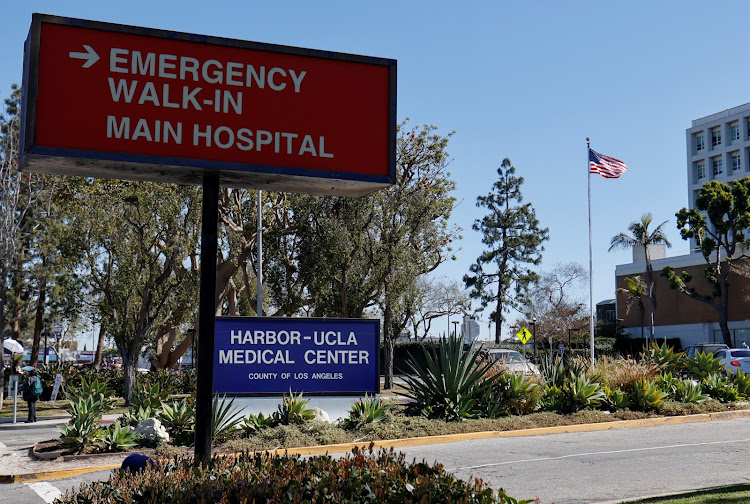 The US flag flutters outside the Harbor-UCLA Medical Center, where professional golfer Tiger Woods was brought following his accident, in Torrance, California, US, on February 24, 2021.