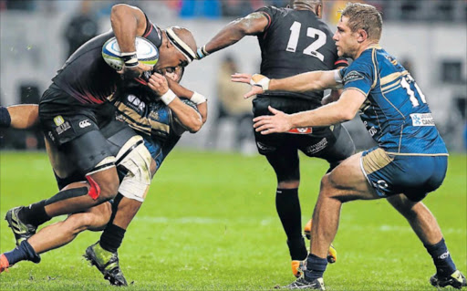 HOLD ON TO WHAT YOU GOT: Andisa Ntsila, a former Queenian, seen here with ball in hand, has been selected to start for the SA ‘A’ team in their second match against the French Barbarians, taking place at the Orlando Stadium in Soweto tomorrow night Picture: GALLO IMAGES