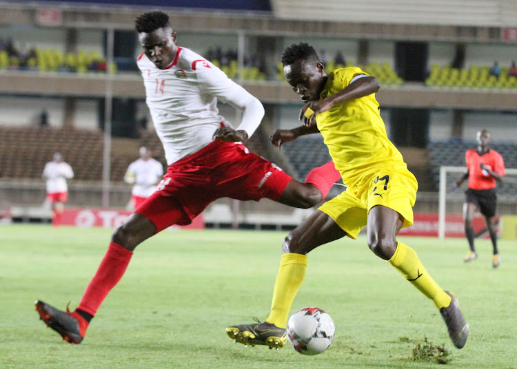 Kenya's Michael Olunga battles Togo's Dokonam Djene in a past match
