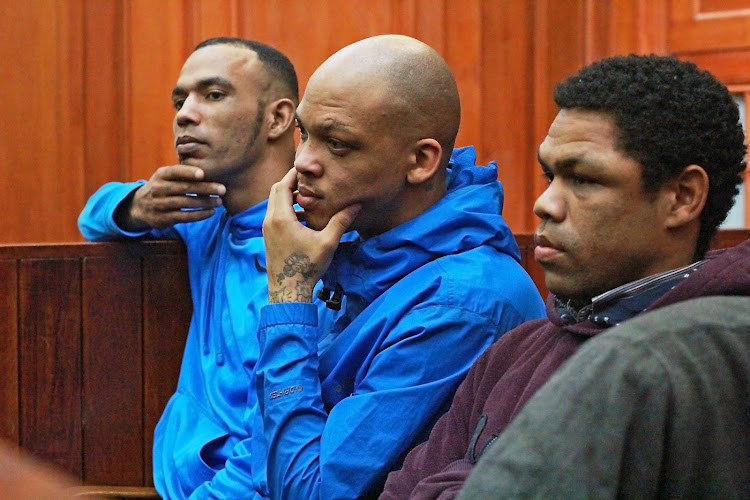 Vernon Witbooi, Geraldo Parsons and Eben van Niekerk in court on judgement day in the murder trial of Hannah Cornelius. The three men have been accused of murdering and raping Cornelius.