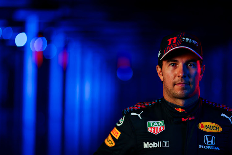 Sergio Perez of Mexico and Red Bull Racing poses for a photo during the Red Bull Racing Filming Day at Silverstone on February 24 2021 in Northampton, England.