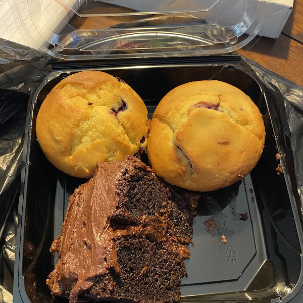 Chocolate cake and large blueberry muffins