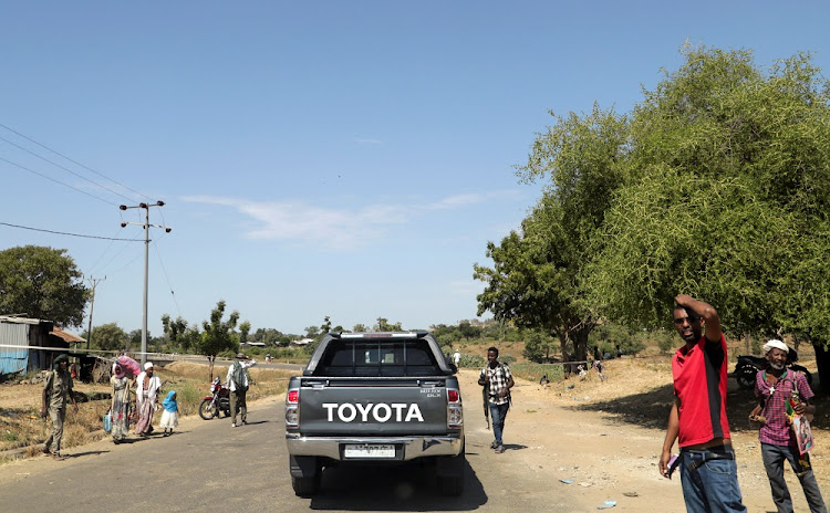 Members of Amhara militia control a motor vehicle checkpoint at the entrance of Dansha town in Tigray Region, Ethiopia November 9, 2020.