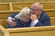 Rob Packham with his daughter Nicola after his bail hearing in Cape Town on Wednesday December 19 2018. He has asked the court for permission to attend the wedding of another daughter.