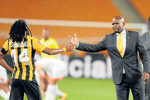 IN DEFENSIVE MODE: Kaizer Chiefs midfielder Siphiwe Tshabalala, giving a handshake to coach Steve Komphela, says players are determined to work their socks off to save the embattled mentor Picture: GALLO IMAGES