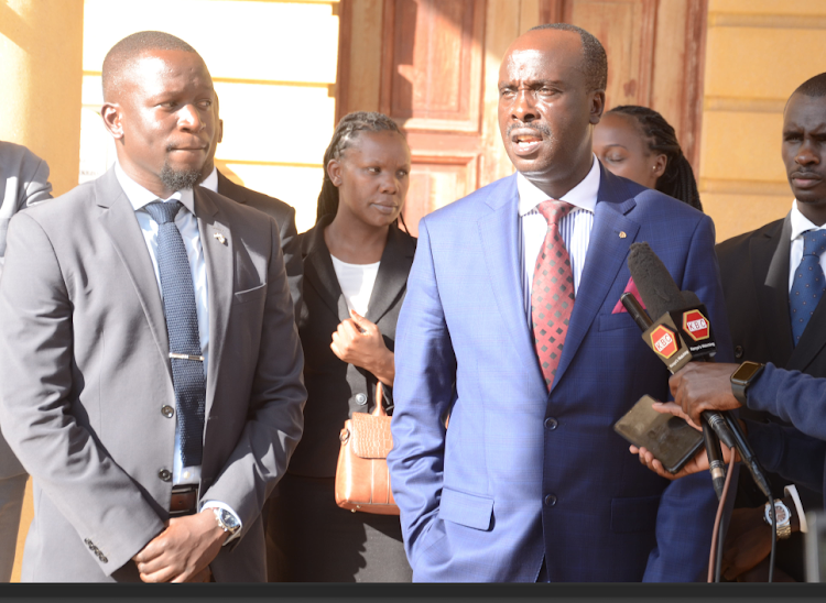 Lawyer Danstan Omari accompanied by other lawyers representing Pastor Ezekiel Odero address journalists outside Milimani Law Courts on Thursday /DOUGLAS OKIDDY