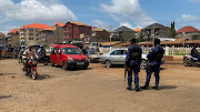 Guinean security forces stand guard during a patrol on a street, after the former head of Guinea's 2008 military junta, Moussa Dadis Camara, was sprung from prison by heavily armed men in Conakry in the early hours of Saturday along with three other high-ranking officers, in Dubreka, a suburb of Conakry, Guinea November 4, 2023. 