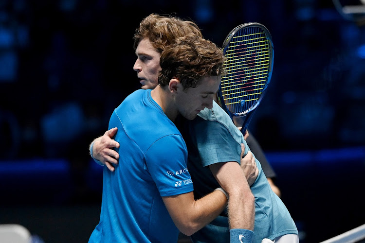 Casper Ruud of Norway embraces Andrey Rublev of Russia after winning their round robin match on Day 6 of the Nitto ATP World Tour Finals at Pala Alpitour in Turin, Italy on November 19 2021.