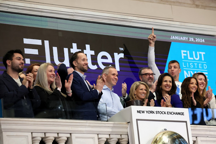 Peter Jackson, CEO of Flutter Entertainment, rings the opening bell to celebrate the company’s listing at the NYSE in New York, the US, January 29 2024. Picture: BRENDAN MCDERMID/REUTERS