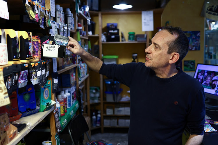Owner of "Hemporium Garbatella" cannabis light shop Silvio Saraceni sorts packages containing hemp flowers derived from hemp plants, a type of Cannabis that contains very low levels of tetrahydrocannabinol (THC), at his shop in Rome, Italy, October 16, 2024.