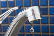 Close-up Of Leakage Tap With Dripping Water Drop