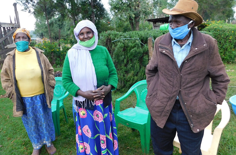 Wives of M’Muthuri Wa M’Nturimbitu with the former Mau Mau member in Meru county