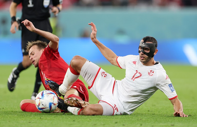 Ellyes Skhiri of Tunisia (right) battles for possession with Mikkel Damsgaard of Denmark in the Fifa World Cup Group D match at Education City Stadium in Al Rayyan, Qatar on November 22 2022.