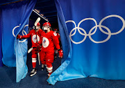 Players of the Russian Olympic Committee wearing face masks due to the coronavirus disease (Covid-19) pandemic step back out after a break in play. 