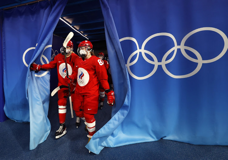 Players of the Russian Olympic Committee wearing face masks due to the coronavirus disease (Covid-19) pandemic step back out after a break in play.