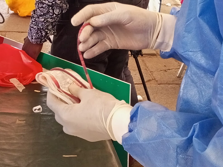 A nurse prepares donated blood for storage at Kencom on October 21, 2022