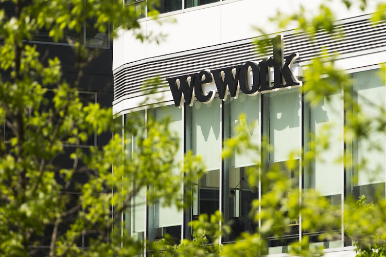 WeWork signage in the Seaport neighborhood of Boston, Massachusetts in the US. Picture: ADAM GLAMZMAN/BLOOMBERG