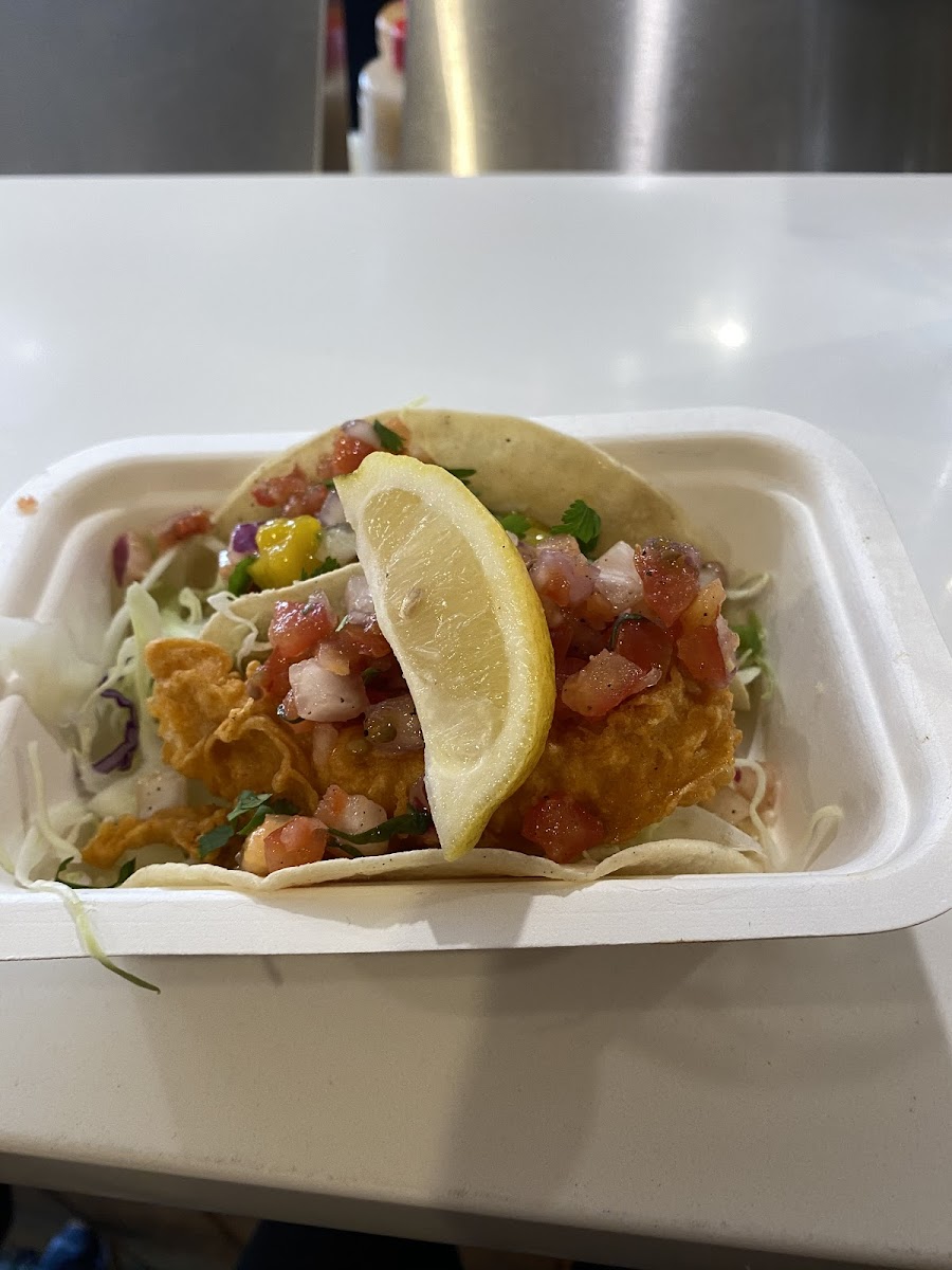 Battered fish taco in front!