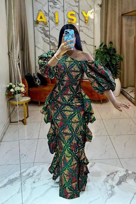 lady taking mirror selfie in an ankara dress