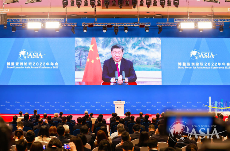 A screen shows Chinese President Xi Jinping delivering a keynote speech at the opening ceremony of the Boao Forum for Asia via video link, at a media centre in Boao, Hainan province, China April 21, 2022.