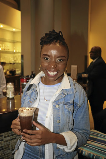 Neo Phashe is all smiles at the launch in Randburg ... and it's not hard to see why. Mixologist Owen O'Reilly demonstrate one of the three soul-warming drinks.