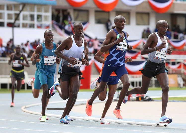 Daniel Simiu and Edward Zakayo lead a pack in the men's 5000m at Kip Keino Classic