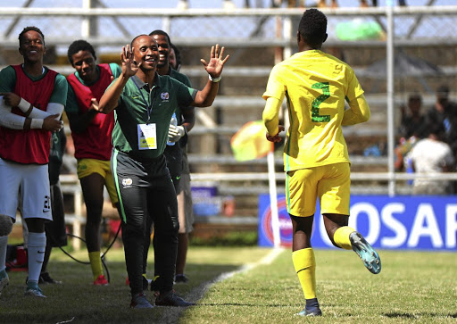 Kamogelo Sambo of Amajita celebrates a goal with coach Thabo Senong.