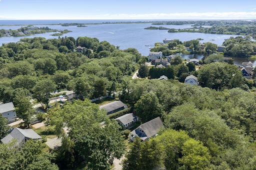 Coastal landscape with houses and dense trees - Buy this luxury house in South Kingstown, 2 bedrooms