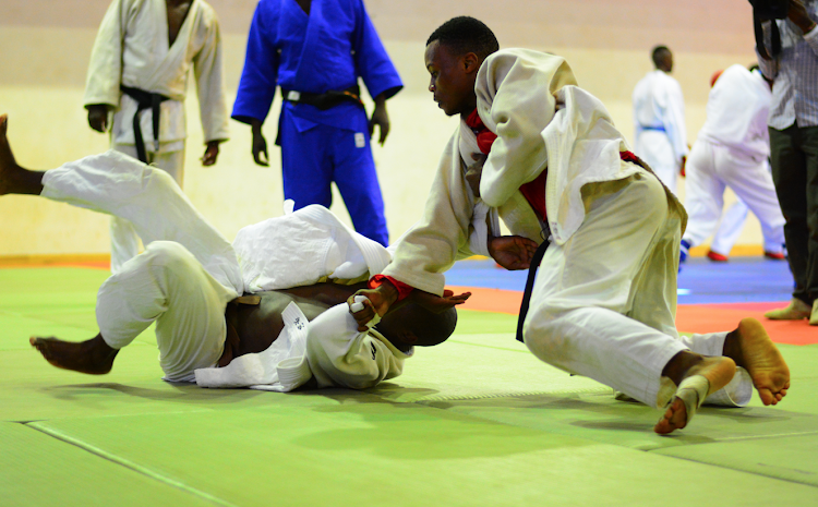 Judoka Carlos Ochieng attacks James Mashobo during a training session at Moi, Kasarani.