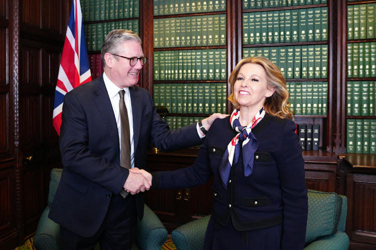 Opposition Labour Party leader Keir Starmer greets Natalie Elphicke, MP for Dover, after her defection, in the House of Commons in London, England, May 8 2024. Picture: CARL COURT/GETTY IMAGES