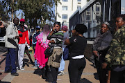 Family members of a Forest High School pupil who was stabbed to death are emotional as they leave the Johannesburg Magistrate's Court where his attacker made a first appearance on June 5 2019. 