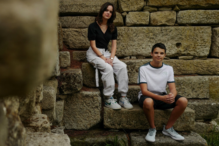 Andre, 15 and Sofia Oliveira, 18 pose for a picture in Almada, Portugal, July 29, 2023. They are part of a group of six that took action in the European court against 32 countries for allegedly failing to do their part to avert climate catastrophe. Picture: REUTERS/PEDRO NUNES