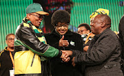 ANC stalwart Winnie Madikizela-Mandela gets ANC President Jacob Zuma and his deputy Cyril Ramaphosa to hold hands before the start of the ANC Policy conference at Nasrec on 6 July 2017.