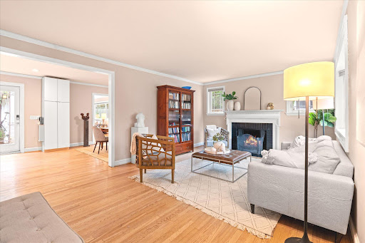 Living room with fireplace and classic furniture in this luxury property for sale in Chevy Chase Manor ($1,195,000)