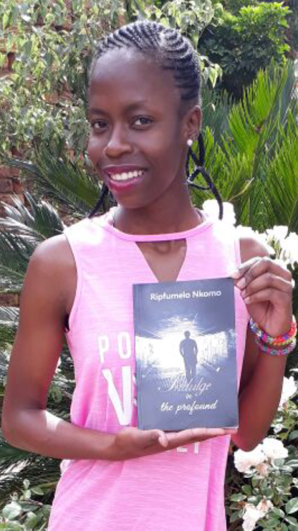 Ripfumelo Nkomo with one of her books.