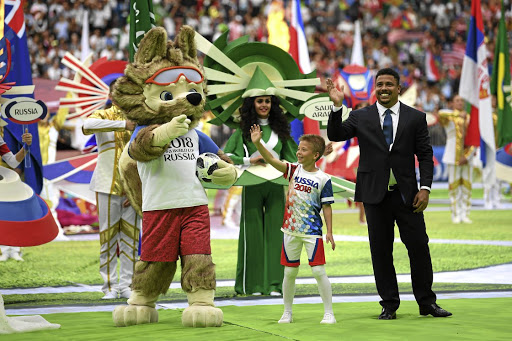 Former Brazil player Ronaldo cheers the fans with the 2018 Fifa World Cup Russia mascot Zabivaka the Wolf prior to the opening match in Moscow this week.