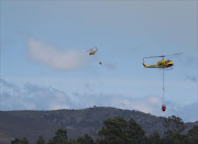 A spotter plane and two Huey Helicopters has been deployed to assist with the ongoing #wildfire #ProtectingTheEnvironment. File photo