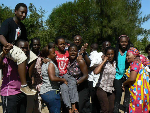 winners: Sean Kuria, Joy Sirma and Valarie Wambui are carried high by relatives and teachers of Juja Preparatory School in Thika West, Kiambu county after emerging top in their school in last year’s KCPE results. Kuria had 411 marks, Sirma 431 and Wambui 428.