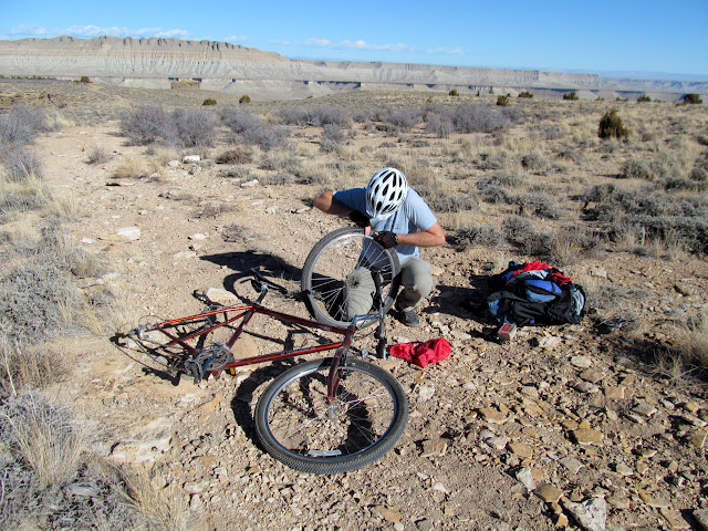 John fixing a flat tire