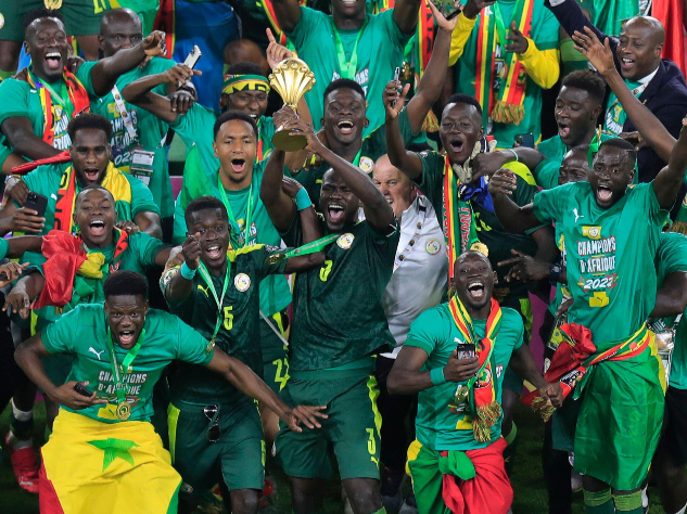 Senegal players celebrate after winning a past Africa Cup of Nations title.