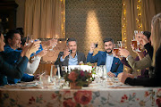 Celebrity chefs David Higgs and J'Something raise a toast with 'My Kitchen Rules' contestants.