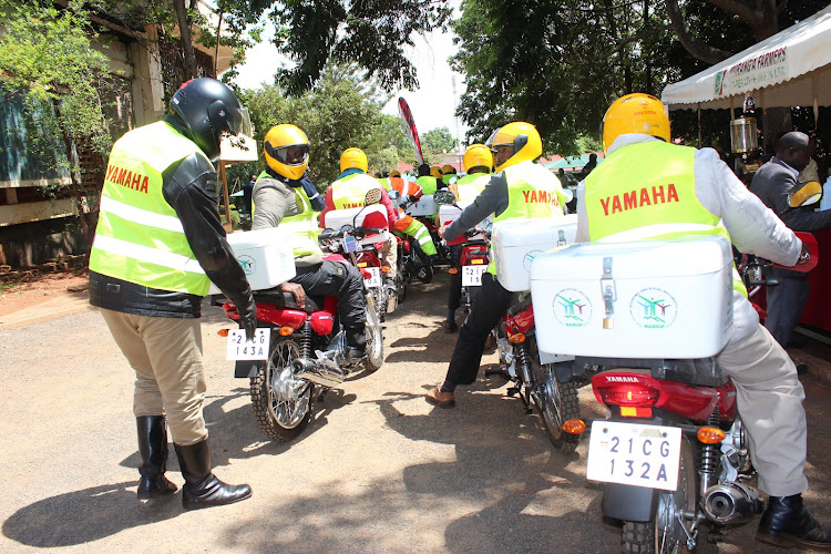 Extension officers with the new bikes from Murang'a County government in partnership with NARIGP.