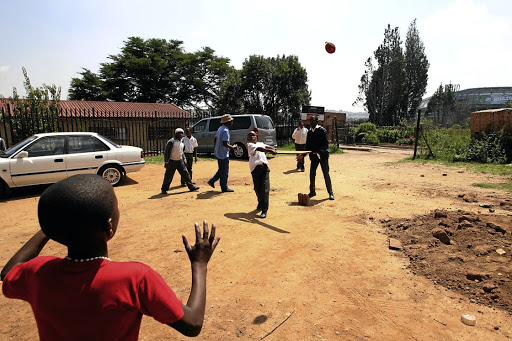 Pupils play cricket at AB Xuma Primary School in Soweto where two school children were allegedly molested by an investigating officer on Monday.