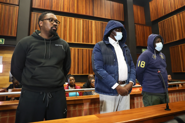 Fidelis Moema and his co-accused Trevor Machimana and metro cop Lebogang Sigubudu appear in the Palm Ridge specialised commercial crimes court.