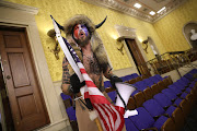 Jacob 'QAnon Shaman' Chansley, the Donald Trump supporter wearing a coyote-skin headdress in the Senate chamber has been slapped with a 41 month jail sentence. 